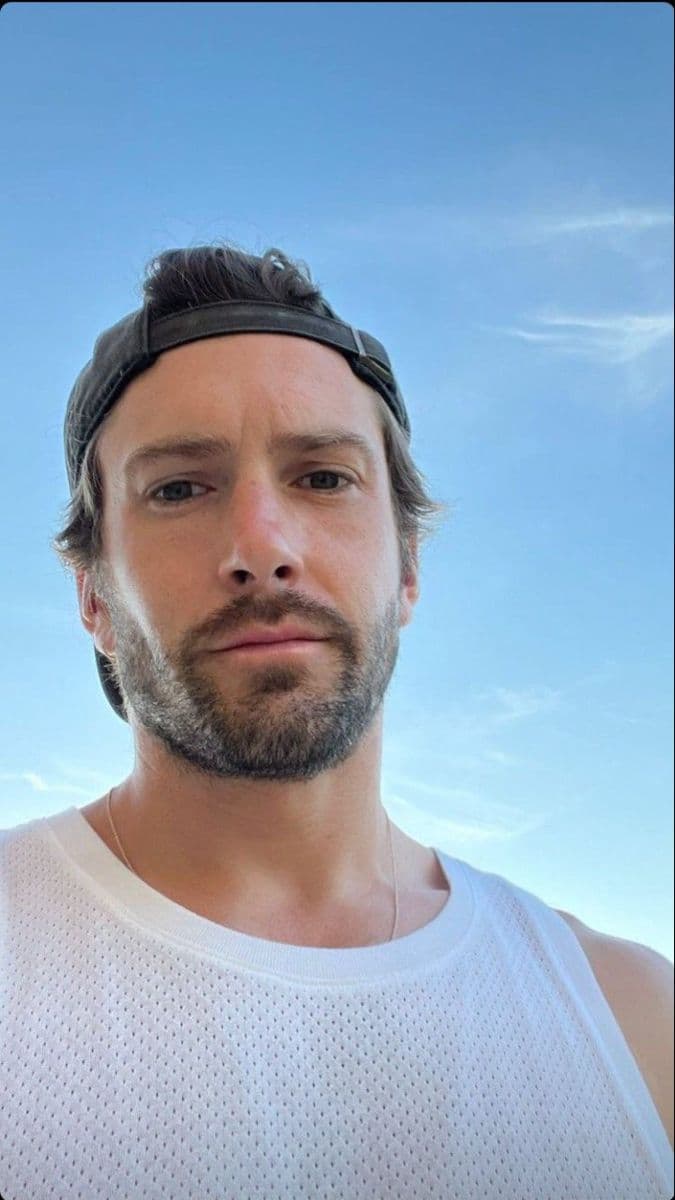 Backwards cap, squinting